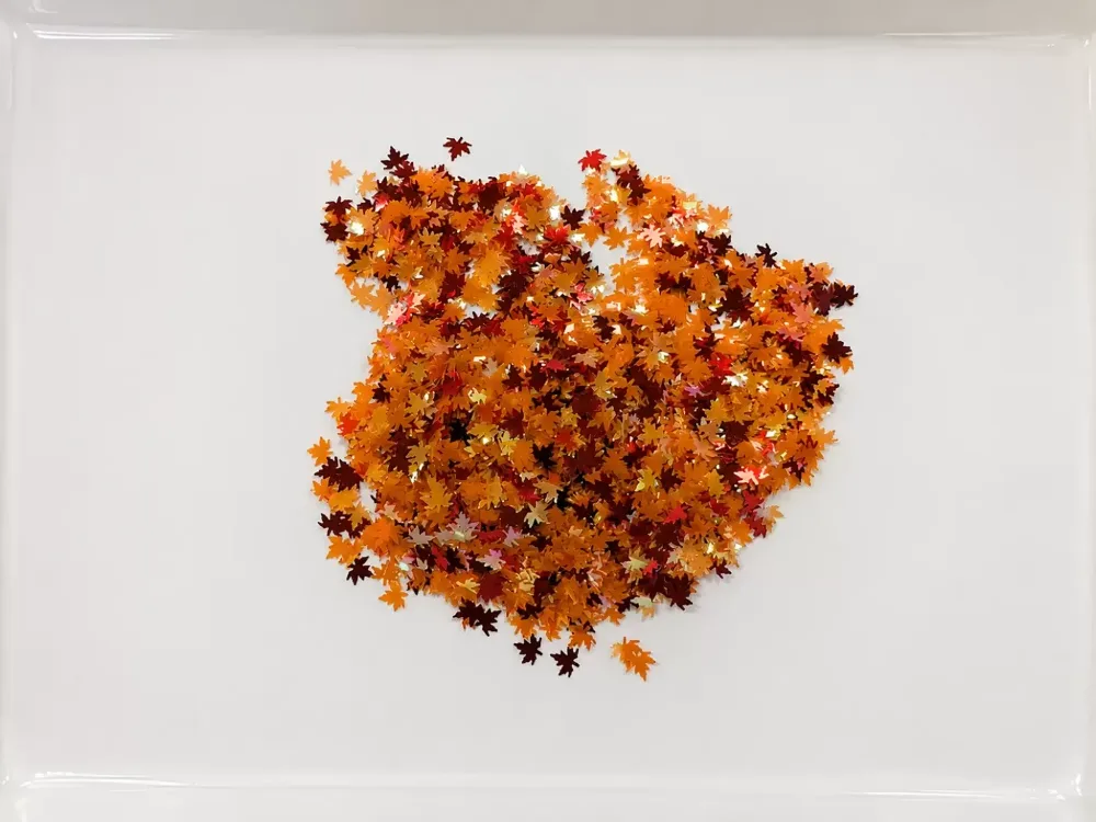 Golden autumn maple leaves – inspiration for the globe's colour palette