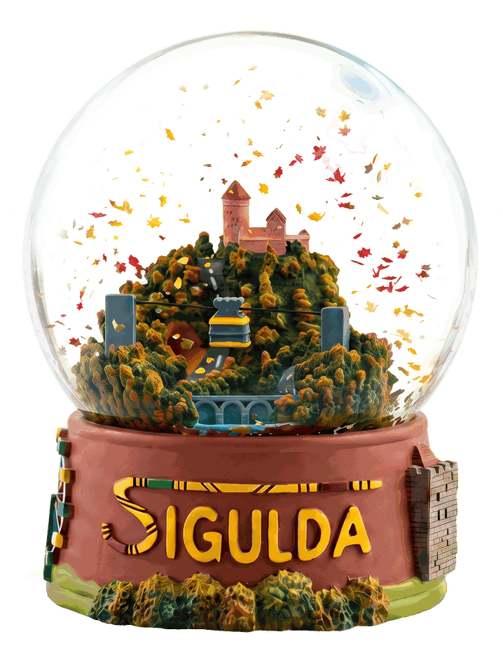 Sigulda Autumn Globe – a glass snow globe with Turaida Castle, the Gauja Bridge and the cable car in a swirl of golden autumn leaves on a red base with the word SIGULDA
